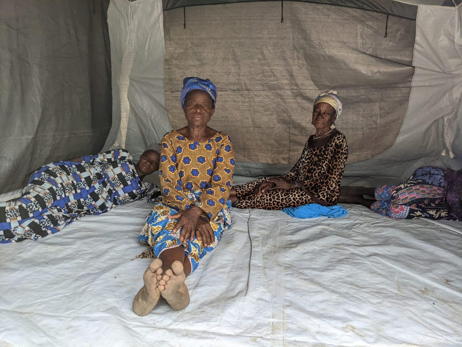 Ajara with other women in a tent at Yarigungu camp